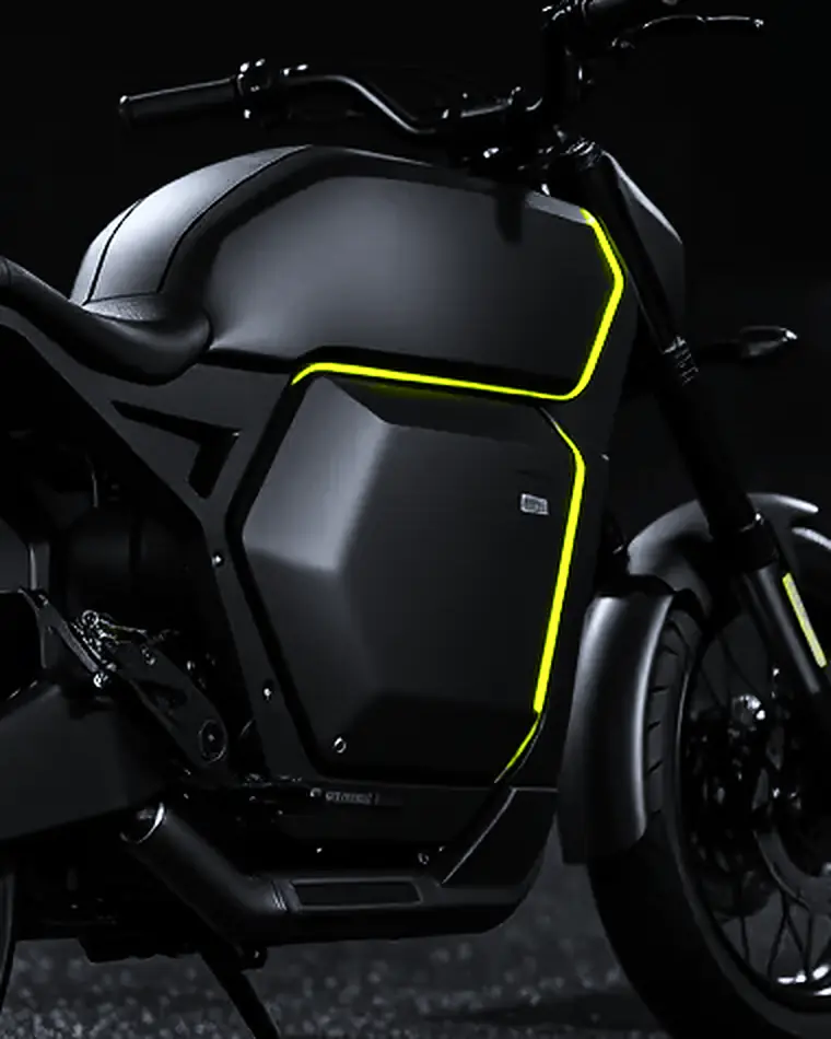 The sealed battery pack at night, a hexagonal casing outlined in a thin lime light, sitting where an engine would be.